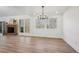 Bright dining room with hardwood floors, a chandelier, and a brick fireplace at 3939 Hamilton Mill Rd, Buford, GA 30519