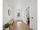 Bright and airy entryway with light wood floors and a built-in bench at 3939 Hamilton Mill Rd, Buford, GA 30519