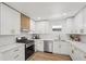 Modern kitchen with white shaker cabinets, quartz countertops, and stainless steel appliances at 3939 Hamilton Mill Rd, Buford, GA 30519