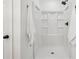 Clean shower with built-in shelving and a white base at 3939 Hamilton Mill Rd, Buford, GA 30519