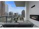 Enjoy city views on this balcony with a fireplace and comfortable seating at 40 12Th Ne St # 1903, Atlanta, GA 30309