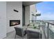 Relax on this spacious balcony with seating and an outdoor fireplace at 40 12Th Ne St # 1903, Atlanta, GA 30309