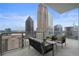 Balcony with a seating area that offers a panoramic view of the city's skyline at 40 12Th Ne St # 1903, Atlanta, GA 30309