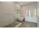Contemporary bathroom with a glass-enclosed shower, soaking tub, and sleek double vanity at 40 12Th Ne St # 1903, Atlanta, GA 30309