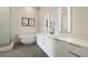 Well-lit bathroom boasting a soaking tub, sleek double vanity, walk-in shower, and contemporary design at 40 12Th Ne St # 1903, Atlanta, GA 30309