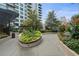 Landscaped courtyard with colorful flowers and seating areas at 40 12Th Ne St # 1903, Atlanta, GA 30309
