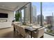Bright dining room with floor-to-ceiling windows and city views at 40 12Th Ne St # 1903, Atlanta, GA 30309