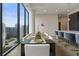 Dining table with gold chargers and city views at 40 12Th Ne St # 1903, Atlanta, GA 30309