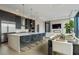 Modern kitchen with stainless steel appliances and a large island at 40 12Th Ne St # 1903, Atlanta, GA 30309