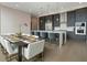 Open kitchen with large island, modern cabinets, and stainless appliances adjoins dining space at 40 12Th Ne St # 1903, Atlanta, GA 30309