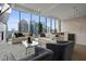 Spacious living room with city skyline views, fireplace, and modern decor at 40 12Th Ne St # 1903, Atlanta, GA 30309