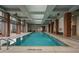 Indoor lap pool with large windows and seating at 40 12Th Ne St # 1903, Atlanta, GA 30309
