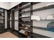 Organized walk-in closet with custom shelving and storage solutions at 40 12Th Ne St # 1903, Atlanta, GA 30309