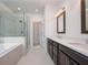 Elegant bathroom with double vanity, soaking tub, and separate shower at 601 Millcroft Blvd, Buford, GA 30518
