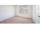 Simple bedroom with neutral carpet and large window at 601 Millcroft Blvd, Buford, GA 30518