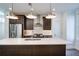 Modern kitchen with stainless steel appliances and large island at 601 Millcroft Blvd, Buford, GA 30518
