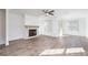 Spacious living room with fireplace and hardwood floors at 601 Millcroft Blvd, Buford, GA 30518