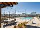 Resort-style pool area with lounge chairs and covered seating at 601 Millcroft Blvd, Buford, GA 30518