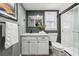 Modern bathroom with white vanity and marble shower at 1617 Church Ne St, Conyers, GA 30012