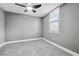 Simple bedroom with ceiling fan and gray walls at 1617 Church Ne St, Conyers, GA 30012