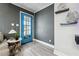 Modern entryway with a vibrant blue door and stylish decor at 1617 Church Ne St, Conyers, GA 30012