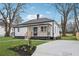 Newly renovated home with a front yard and a concrete driveway at 1617 Church Ne St, Conyers, GA 30012