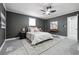 Main bedroom with carpet, ceiling fan and neutral decor at 1617 Church Ne St, Conyers, GA 30012