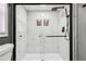Large walk-in shower with marble tile and glass enclosure at 1617 Church Ne St, Conyers, GA 30012