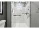 Clean shower with marble tile and glass enclosure at 1617 Church Ne St, Conyers, GA 30012