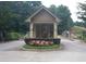 A well maintained and beautifully landscaped community gate house at 2225 Mountain Creek Dr, Stone Mountain, GA 30087