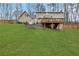 Large backyard features a sprawling lawn and a raised deck at 2225 Mountain Creek Dr, Tucker, GA 30087