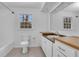 Bathroom featuring neutral tile, a window, and granite countertop at 2225 Mountain Creek Dr, Tucker, GA 30087