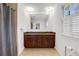 Bathroom features a large vanity with dual sinks and shutters at 2225 Mountain Creek Dr, Tucker, GA 30087