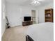 Well-lit bedroom with carpet, a ceiling fan, and space for entertainment at 2225 Mountain Creek Dr, Tucker, GA 30087