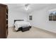 Bright bedroom features neutral carpet, a ceiling fan, and sunny windows at 2225 Mountain Creek Dr, Tucker, GA 30087