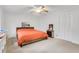 Spacious bedroom featuring neutral carpet, ceiling fan and ample closet space at 2225 Mountain Creek Dr, Tucker, GA 30087