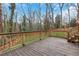 Wooden deck area with backyard views and wooden railing at 2225 Mountain Creek Dr, Tucker, GA 30087