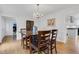 Bright dining room featuring a chandelier, wood flooring, and views of the outside at 2225 Mountain Creek Dr, Tucker, GA 30087