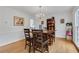 Spacious dining room with hardwood floors, chandelier, and a large window at 2225 Mountain Creek Dr, Tucker, GA 30087