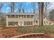 Charming two-story home with a well-maintained lawn, mature trees, and a classic facade at 2225 Mountain Creek Dr, Tucker, GA 30087