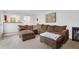 Inviting living room with a plush brown sectional and neutral decor creates a relaxing space at 2225 Mountain Creek Dr, Tucker, GA 30087