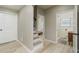 Bright hallway with light wood floors and white doors at 966 Ashby Grove Sw Grv, Atlanta, GA 30314