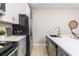 Modern kitchen with gray cabinets, white countertops, and a large island at 966 Ashby Grove Sw Grv, Atlanta, GA 30314