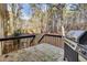 Deck overlooks a wooded backyard, great for grilling and entertaining at 4684 Pine Dr, Loganville, GA 30052