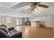 Finished basement recreation area with wet bar and two ceiling fans at 4684 Pine Dr, Loganville, GA 30052