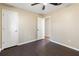 Bedroom with dark hardwood floors and neutral walls at 4684 Pine Dr, Loganville, GA 30052