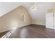 Bright bedroom with vaulted ceiling, ceiling fan, and hardwood floors at 4684 Pine Dr, Loganville, GA 30052