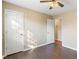 Well-lit bedroom with wood flooring and neutral walls at 4684 Pine Dr, Loganville, GA 30052