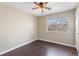 Spacious bedroom with dark hardwood floors and a ceiling fan at 4684 Pine Dr, Loganville, GA 30052