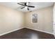 Bedroom with dark hardwood floors and a window view at 4684 Pine Dr, Loganville, GA 30052